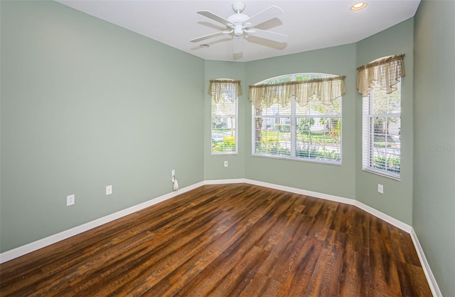 15925 Pond Rush Ct, Land O Lakes, FL 34638 - unfurnished room with dark wood-style floors, a ceiling fan, and recessed lighting