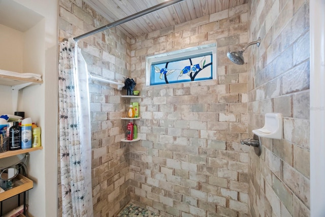 bathroom with a tile shower
