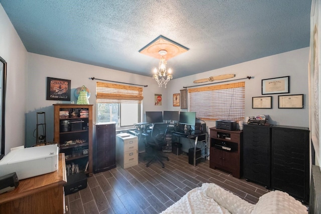 office area with a textured ceiling, a notable chandelier, and dark wood finished floors