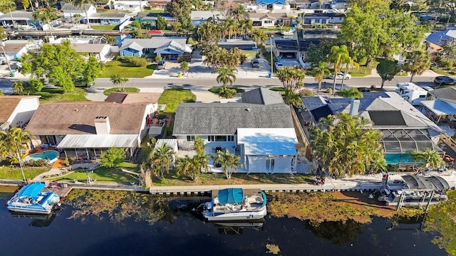bird's eye view with a water view and a residential view