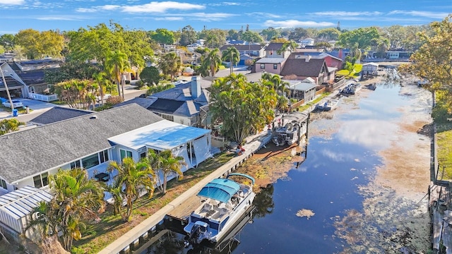 birds eye view of property with a water view and a residential view