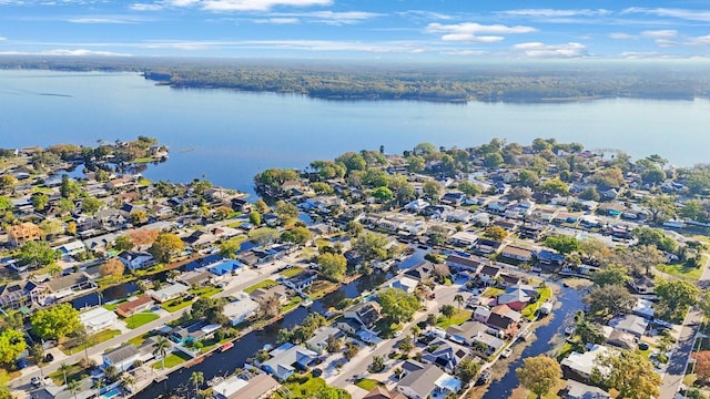 drone / aerial view featuring a water view and a residential view