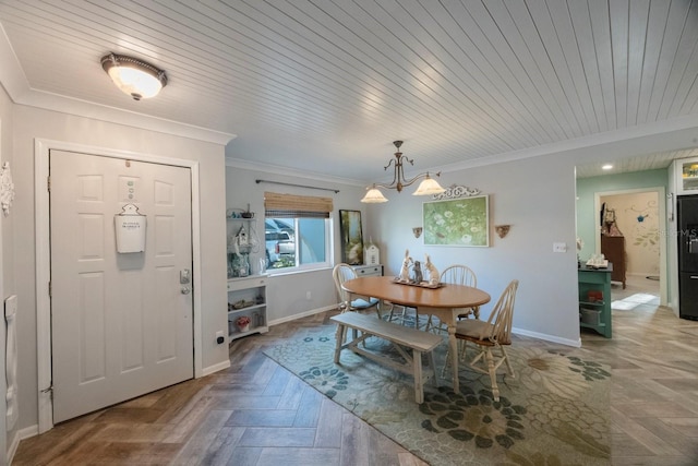 dining space with baseboards, crown molding, a notable chandelier, and wooden ceiling