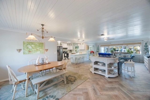 dining room featuring visible vents, wooden ceiling, baseboards, ceiling fan with notable chandelier, and ornamental molding