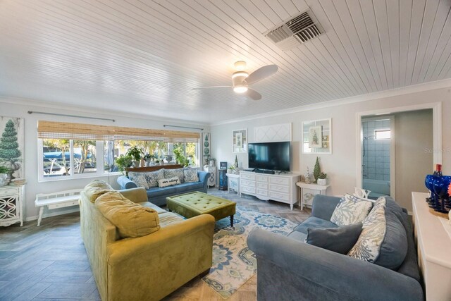 living area with crown molding, wood ceiling, ceiling fan, and visible vents