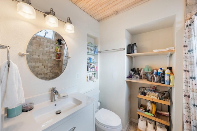 full bathroom featuring vanity, toilet, and wood ceiling