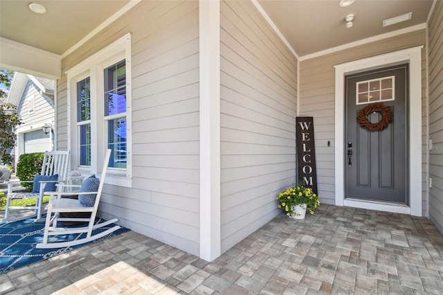 doorway to property with covered porch