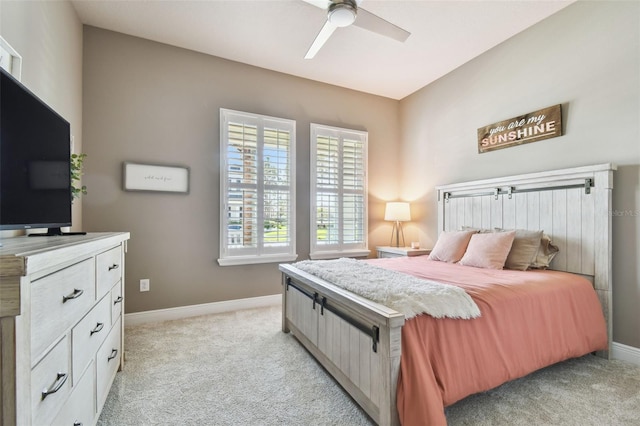 bedroom with baseboards, light colored carpet, and a ceiling fan