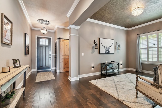 foyer with dark wood finished floors, plenty of natural light, baseboards, and ornamental molding