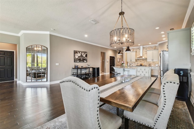 dining space featuring visible vents, dark wood-style floors, recessed lighting, baseboards, and a chandelier
