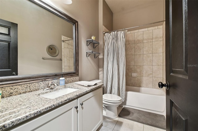 bathroom with tile patterned floors, toilet, vanity, and shower / tub combo