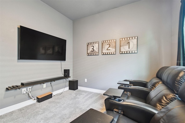 carpeted living area with baseboards