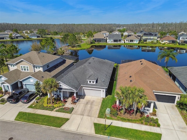 bird's eye view with a residential view and a water view