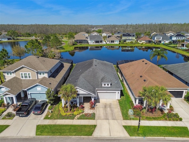 bird's eye view featuring a residential view and a water view