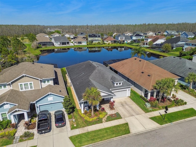 bird's eye view featuring a residential view and a water view