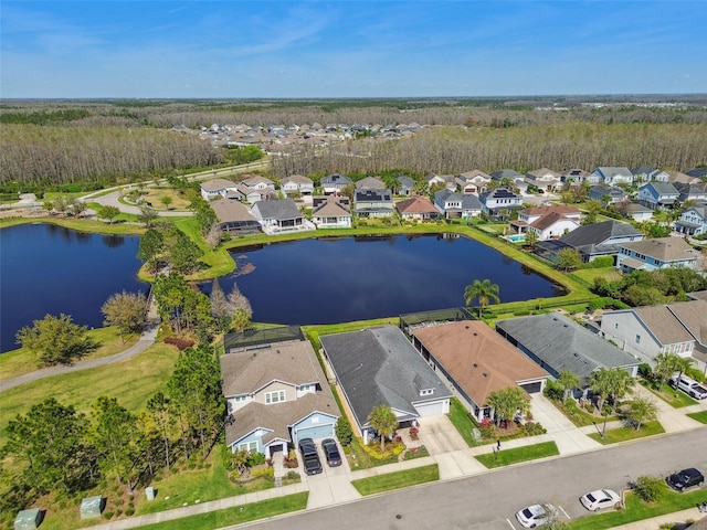 aerial view with a residential view and a water view