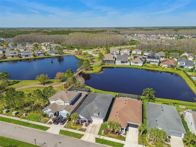 aerial view featuring a residential view and a water view