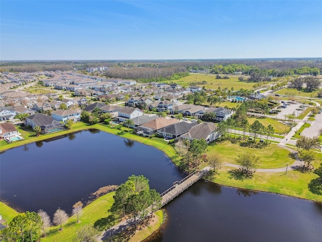 bird's eye view with a residential view and a water view