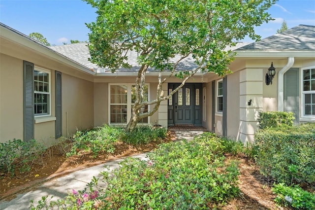 20315 Mid Ct, Lutz, FL 33558 - entrance to property with roof with shingles and stucco siding