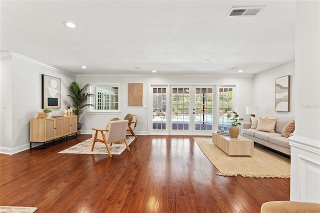 20315 Mid Ct, Lutz, FL 33558 - living area with dark wood-style flooring, french doors, recessed lighting, visible vents, and ornamental molding