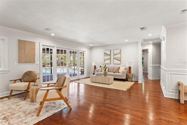 20315 Mid Ct, Lutz, FL 33558 - living room featuring crown molding, recessed lighting, visible vents, and wood finished floors