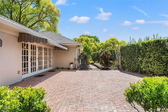 20315 Mid Ct, Lutz, FL 33558 - view of patio with fence and french doors