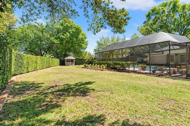 20315 Mid Ct, Lutz, FL 33558 - view of yard featuring a fenced backyard, glass enclosure, and an outdoor pool