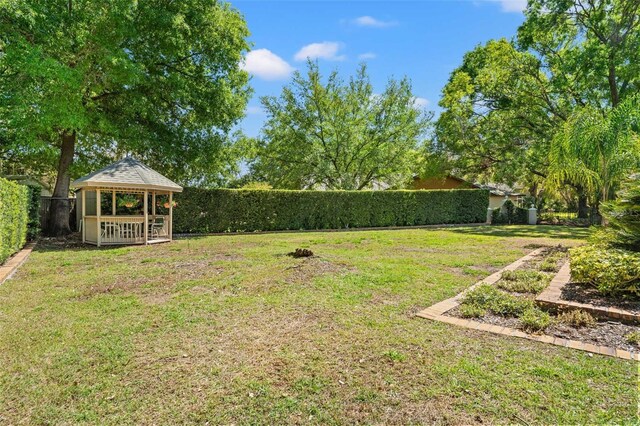 20315 Mid Ct, Lutz, FL 33558 - view of yard with a gazebo and a fenced backyard