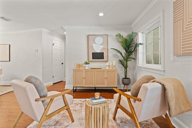 20315 Mid Ct, Lutz, FL 33558 - sitting room featuring visible vents, light wood finished floors, crown molding, and baseboards