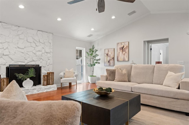 20315 Mid Ct, Lutz, FL 33558 - living area featuring ornamental molding, light wood-style flooring, a ceiling fan, and vaulted ceiling