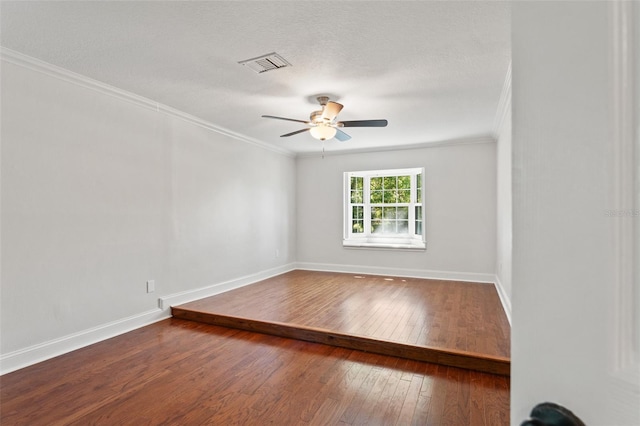 20315 Mid Ct, Lutz, FL 33558 - empty room with wood-type flooring, a ceiling fan, baseboards, visible vents, and ornamental molding