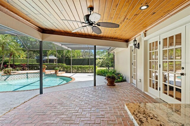 20315 Mid Ct, Lutz, FL 33558 - view of swimming pool featuring a ceiling fan, a patio, a fenced in pool, and french doors