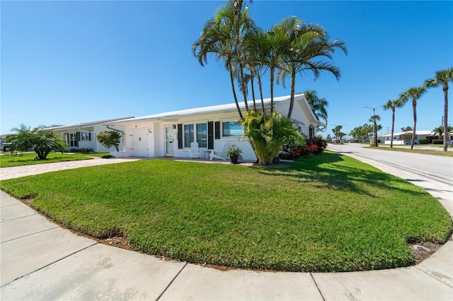 9870 36th Way N, Pinellas Park, FL 33782 - ranch-style home featuring a front yard, concrete driveway, and stucco siding