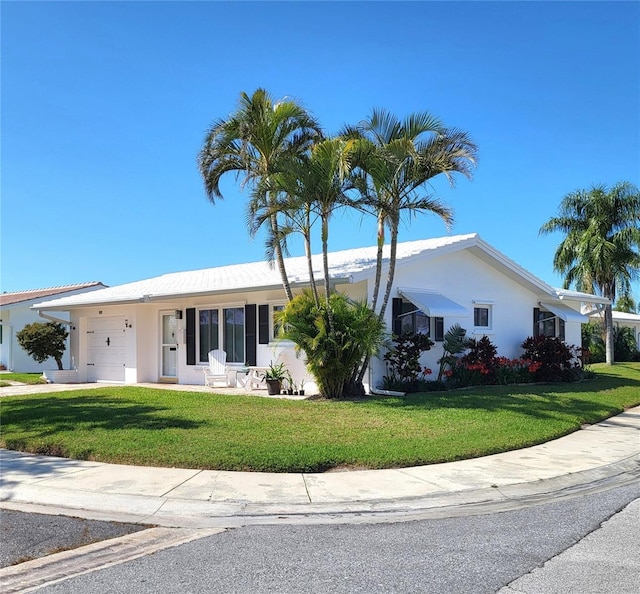 9870 36th Way N, Pinellas Park, FL 33782 - ranch-style house with a garage, a front yard, stucco siding, and driveway