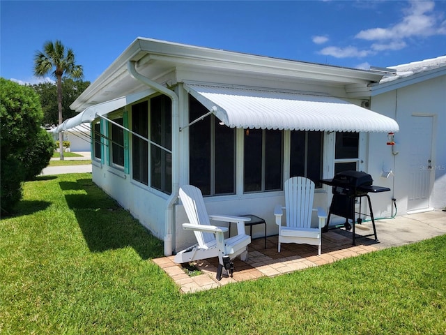 9870 36th Way N, Pinellas Park, FL 33782 - rear view of property with a yard and a patio