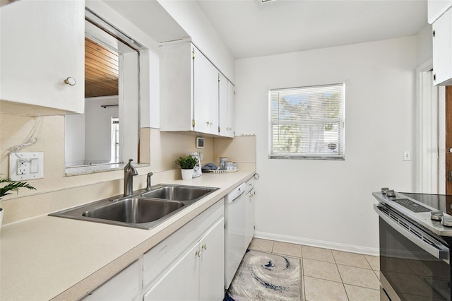 3818 W San Miguel St, Tampa, FL 33629 - kitchen with light countertops, white cabinetry, a sink, white dishwasher, and light tile patterned floors