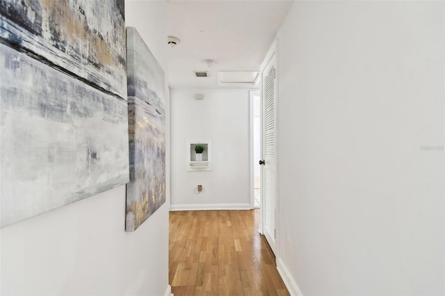 3818 W San Miguel St, Tampa, FL 33629 - hallway featuring attic access, baseboards, and wood finished floors