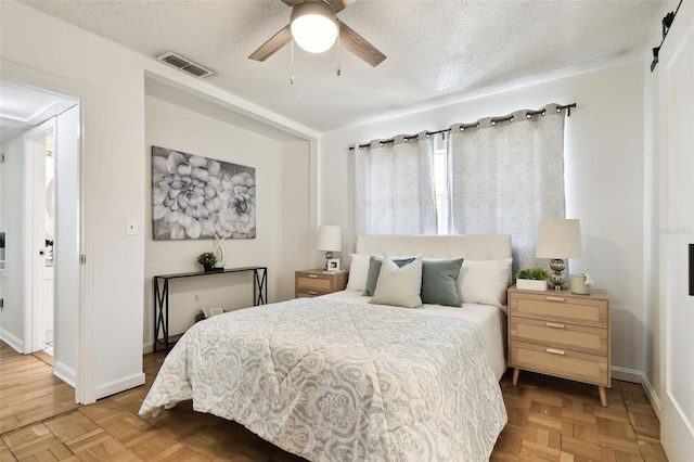 3818 W San Miguel St, Tampa, FL 33629 - bedroom with baseboards, a textured ceiling, visible vents, and a ceiling fan