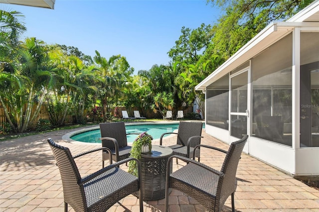 3818 W San Miguel St, Tampa, FL 33629 - view of swimming pool with a fenced backyard, a fenced in pool, a sunroom, and a patio