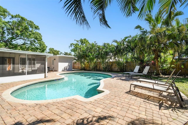 3818 W San Miguel St, Tampa, FL 33629 - view of pool with a fenced backyard, a sunroom, and a patio area