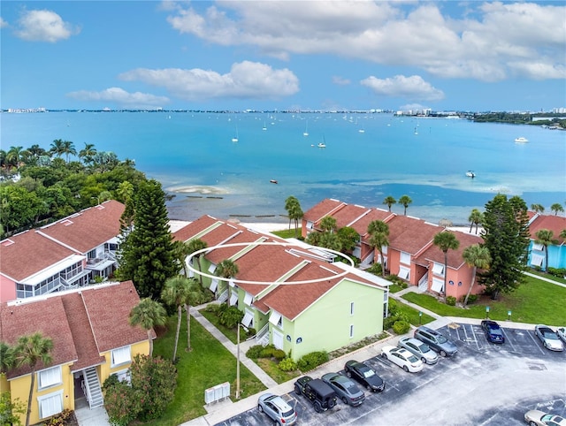 bird's eye view with a water view and a residential view