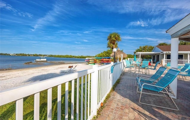3735 42nd Way S Unit J, Saint Petersburg, FL 33711 - view of patio / terrace with outdoor dining space and a water view