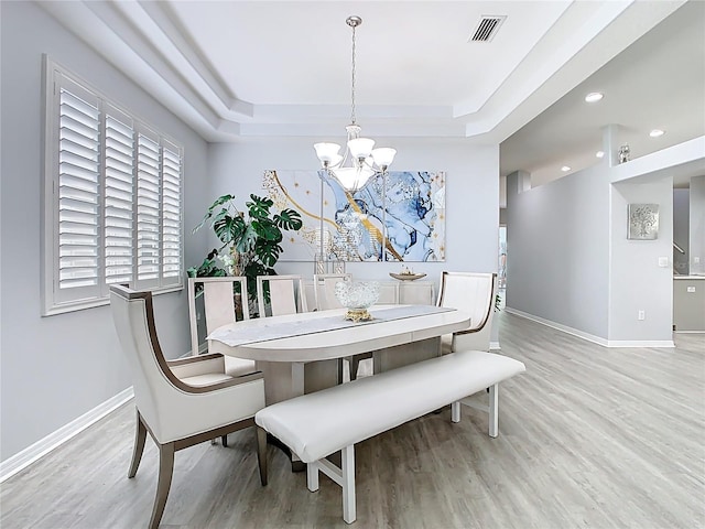 2327 Shirecrest Cove Way, Lutz, FL 33558 - dining area with a chandelier, light wood finished floors, a raised ceiling, and recessed lighting