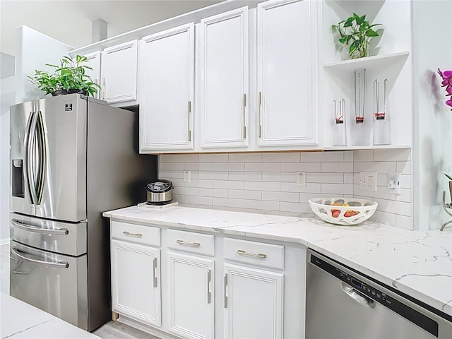 2327 Shirecrest Cove Way, Lutz, FL 33558 - kitchen with appliances with stainless steel finishes, open shelves, white cabinetry, and decorative backsplash
