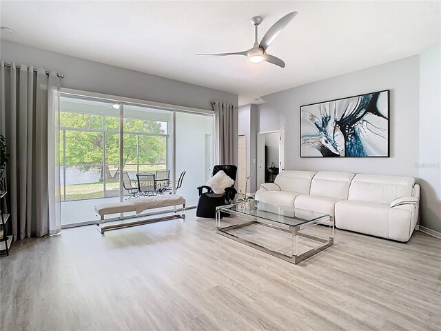 2327 Shirecrest Cove Way, Lutz, FL 33558 - living area with wood finished floors and ceiling fan