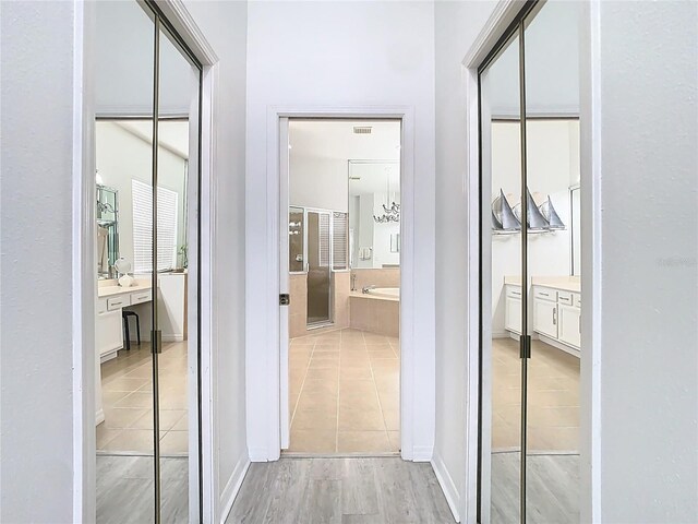 2327 Shirecrest Cove Way, Lutz, FL 33558 - corridor with light tile patterned floors
