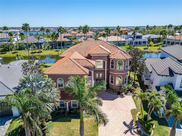 aerial view featuring a residential view and a water view