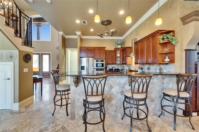 kitchen featuring open shelves, decorative backsplash, a peninsula, appliances with stainless steel finishes, and visible vents