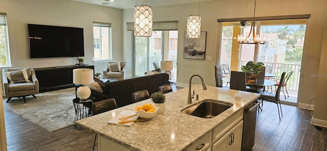 16 Franklin Ct S Unit A, Saint Petersburg, FL 33711 - kitchen with a sink, open floor plan, decorative light fixtures, dishwasher, and dark wood-style floors