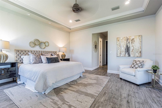 16 Franklin Ct S Unit A, Saint Petersburg, FL 33711 - bedroom with a raised ceiling, baseboards, visible vents, and wood finished floors